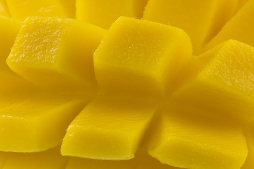 macro of freshly sliced mango fruit ready to eat