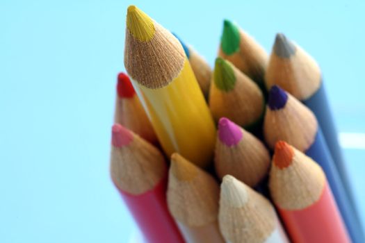 Bunch of pencils with one pencil sticks out, can be used for leadership symbol.