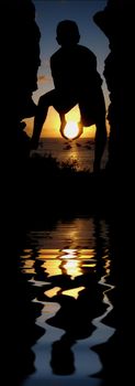 The silhouette of a young person holding the Sun. 

(with water reflection)