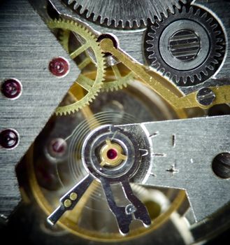 super macro part of clock mechanism, old watch with gems