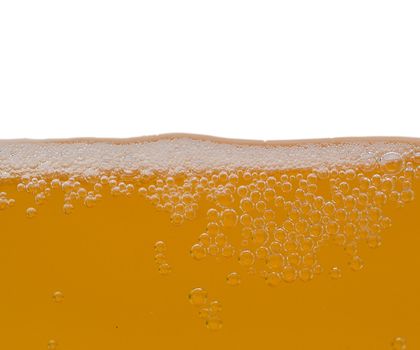 close-up unfiltered beer with bubbles, isolated on white