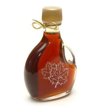 A small bottle of maple syrup with the maple leaves printed on the front and a nice golden ribbon on the neck!
