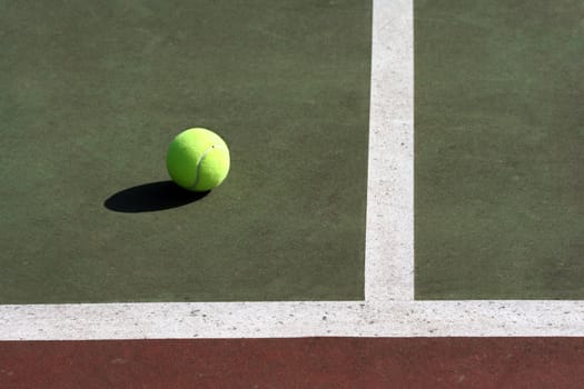 Tennis ball in tennis court