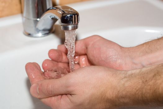 washing the hands in bathroom