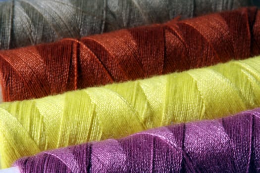 Close up image of colorful threads