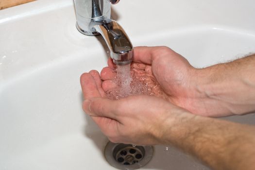 washing the hands in bathroom