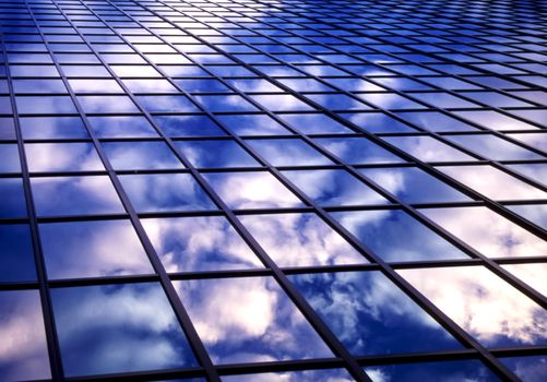 Clouds reflection on office windows
