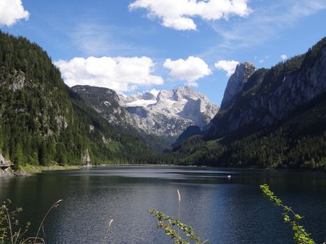 Dachstein with lake Gosau and some clouds