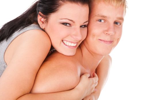 Happy teens couple cuddling over isolated white