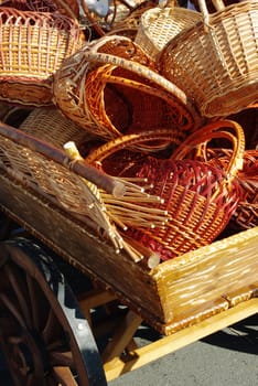 Old dray full of handmade wood baskets