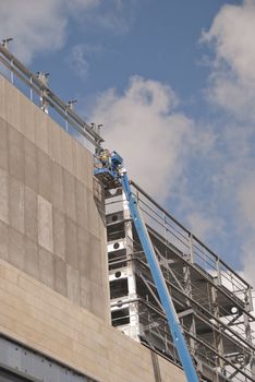 A Blue Cherry Picker Platform on a construction site