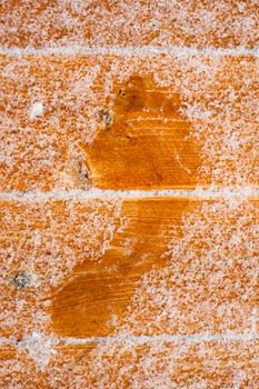 Barefooted human foot prints on frosted wooden deck planks (after sauna bath).