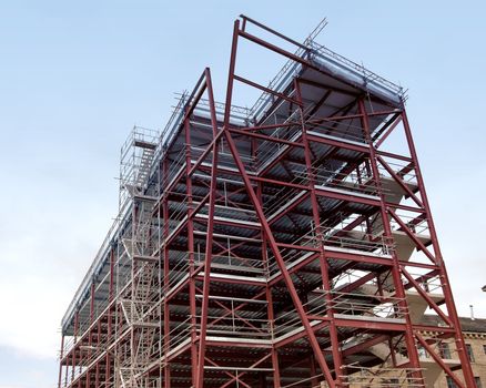 A Red Oxide Painted Steel Framed Building under a blue sky