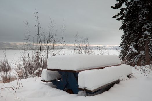 Closed for the season: beautiful lakeside campsite burried in snow.