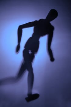 blurry silhouette of a figure in motion