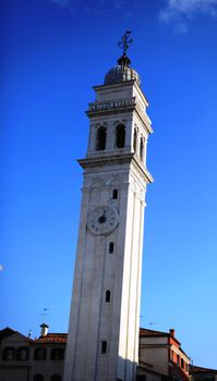 Bell tower on blue sky background