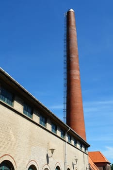 Factory plant building with a chimney vertical industry manufacturing  background