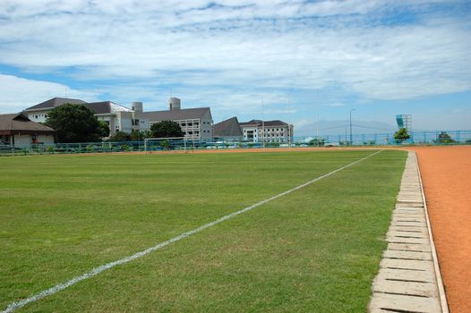 soccer field with nice green grass and blue sky