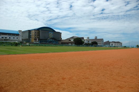 soccer field with nice green grass and blue sky