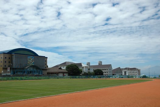 soccer field with nice green grass and blue sky