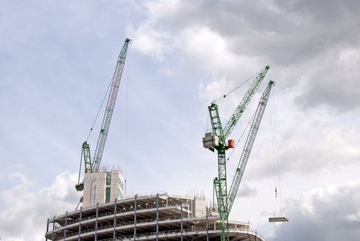 Three Heavy Lift Cranes ontop of a construction site