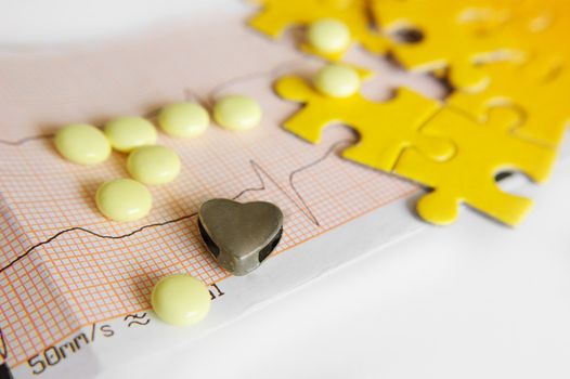 ECG diagram and pills with symbolic heart