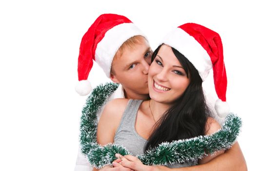 Young couple celebrating christmas over isolated white