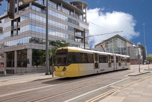 A Modern Yellow Tram on an English City Street