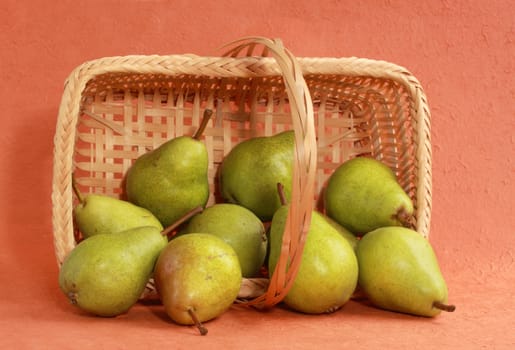 fresh pears in a wicker basket
