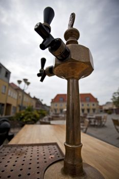 outdoor beer tap on a cloudy day