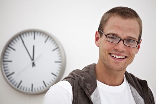 smiling man and a wall clock