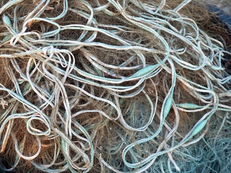 Details of fishing nets in close view in a fishermen port
