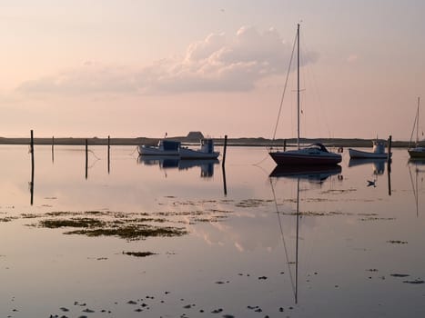 Magical sunset with boats reflection in the sea perfect sailing boating horizontal image