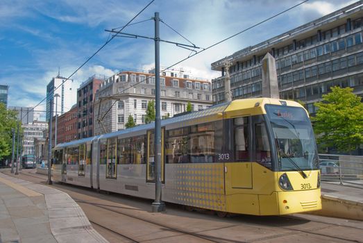 A Modern Yellow Tram on an English City Street