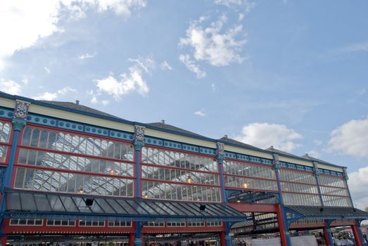 The Ornate Brightly Coloured Cast Iron Facade of a Victorian Era Market Hall