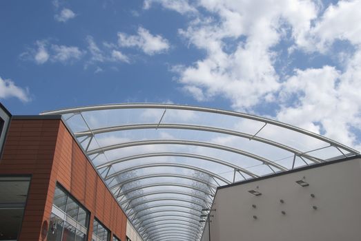 The Arched Steel and Glass Roof of a shopping Mall
