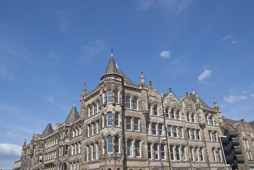 A Vintage Stone Built Office Block under a blue sky