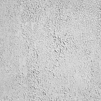 Surface of the painted peeled concrete gray wall