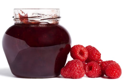  raspberry jam jar with raspberries aside on white background