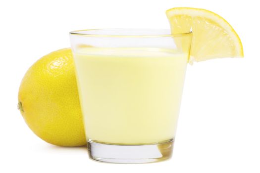 lemon milkshake with a piece of lemon in front of a lemon on white background
