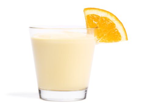 piece of a orange on a milkshake on white background