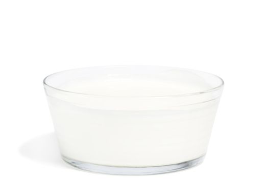 yogurt in a glass bowl on white background
