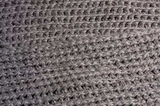 Gray yarn crocheted in a simple pattern