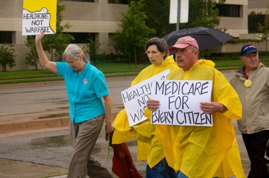 OKLAHOMA CITY, OK - SEPTEMBER 13, 2009: Protesters march to the Oklahoma capitol building to demonstrate their support for health care reform on September 13, 2009 in Oklahoma City, Oklahoma.