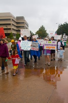 OKLAHOMA CITY, OK - SEPTEMBER 13, 2009: Protesters march to the Oklahoma capitol building to demonstrate their support for health care reform on September 13, 2009 in Oklahoma City, Oklahoma.