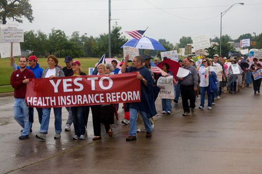 OKLAHOMA CITY, OK - SEPTEMBER 13, 2009: Protesters march to the Oklahoma capitol building to demonstrate their support for health care reform on September 13, 2009 in Oklahoma City, Oklahoma.