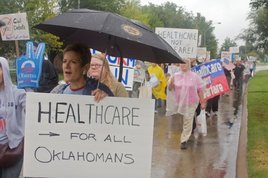 OKLAHOMA CITY, OK - SEPTEMBER 13, 2009: Protesters march to the Oklahoma capitol building to demonstrate their support for health care reform on September 13, 2009 in Oklahoma City, Oklahoma.