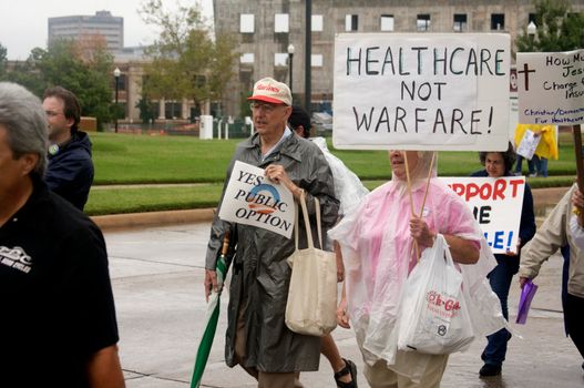 OKLAHOMA CITY, OK - SEPTEMBER 13, 2009: Protesters march to the Oklahoma capitol building to demonstrate their support for health care reform on September 13, 2009 in Oklahoma City, Oklahoma.