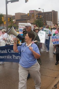 OKLAHOMA CITY, OK - SEPTEMBER 13, 2009: Protesters march to the Oklahoma capitol building to demonstrate their support for health care reform on September 13, 2009 in Oklahoma City, Oklahoma.