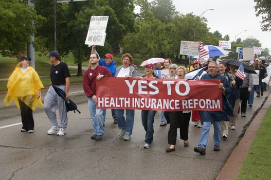 OKLAHOMA CITY, OK - SEPTEMBER 13, 2009: Protesters march to the Oklahoma capitol building to demonstrate their support for health care reform on September 13, 2009 in Oklahoma City, Oklahoma.